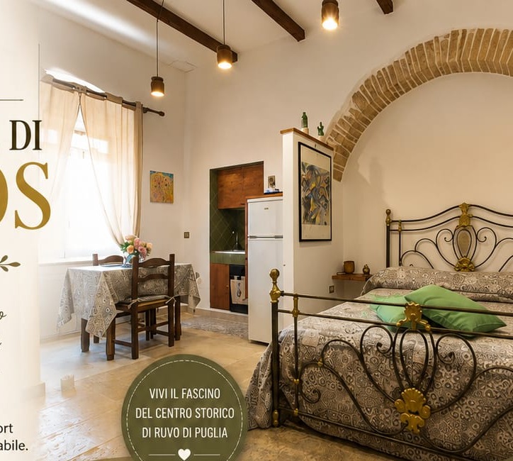 Interno luminoso di Talos B&B con letto in ferro battuto